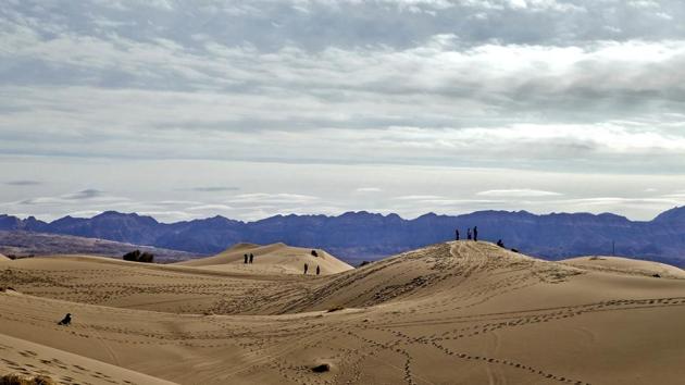 Iranian youths enjoy their weekend in the Mesr desert. Mesr town is known for its gardens and date palm orchards. (AP)