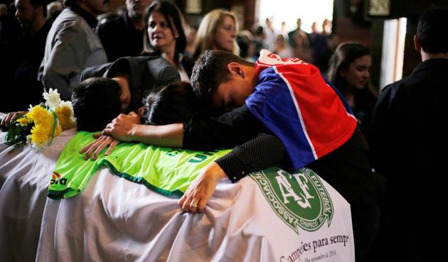 Relatives of Chapecoense club head coach Caio Junior, who died in the plane crash in Colombia, participate in a ceremony to pay tribute to him in Curitiba, Brazil. (REUTERS) Relatives of Chapecoense club head coach Caio Junior, who died in the plane crash in Colombia, participate in a ceremony to pay tribute to him in Curitiba, Brazil. (REUTERS)