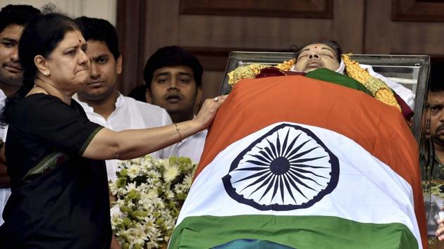 V Sasikala, a close aide of Tamil Nadu's former chief minister J Jayalalithaa stands near her mortal remains kept at Rajaji Hall. (PTI) V Sasikala, a close aide of Tamil Nadu's former chief minister J Jayalalithaa stands near her mortal remains kept at Rajaji Hall. (PTI)