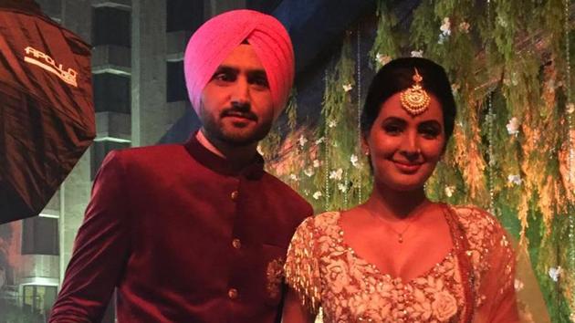Harbhajan Singh poses with his wife Geeta Basra. (ht photo)