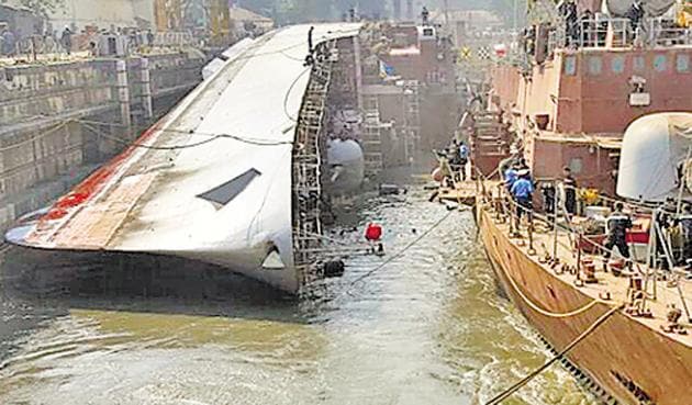 A day after INS Betwa, a guided missile frigate, tipped over during undocking at the Naval Dockyard, Navy chief Admiral Sunil Lanba on Tuesday visited the site to take stock of the damages. The accident killed two personnel and injured 14 others. (HT) A day after INS Betwa, a guided missile frigate, tipped over during undocking at the Naval Dockyard, Navy chief Admiral Sunil Lanba on Tuesday visited the site to take stock of the damages. The accident killed two personnel and injured 14 others. (HT)