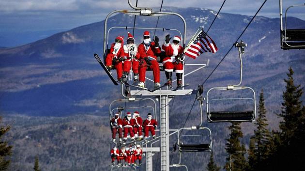 Some of the skiers dressed as Santa Claus ride the chairlift. (AP) Some of the skiers dressed as Santa Claus ride the chairlift. (AP)