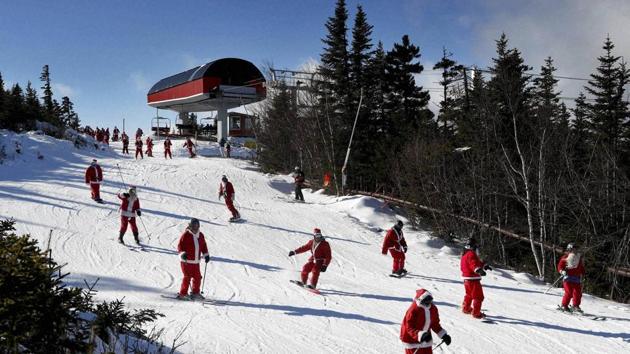 Skiers dressed as Santa Claus ski en masse on December 4, 2016 in Newry, Maine. (AP) Skiers dressed as Santa Claus ski en masse on December 4, 2016 in Newry, Maine. (AP)
