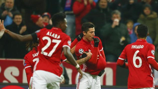 Bayern Munich's Robert Lewandowski celebrates after scoring against Atletico Madrid in their Champions League match at the Allianz Arena in Munich on Tuesday. Munich beat Atletico 2-1 but the Spanish side, with 15 points, advanced to the next stage as Group D winners, ahead of Bayern Munich (12). (REUTERS) Bayern Munich's Robert Lewandowski celebrates after scoring against Atletico Madrid in their Champions League match at the Allianz Arena in Munich on Tuesday. Munich beat Atletico 2-1 but the Spanish side, with 15 points, advanced to the next stage as Group D winners, ahead of Bayern Munich (12). (REUTERS)