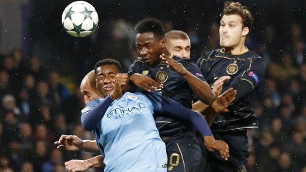 Manchester City's Oluwatosin Adarabioyo fights for the ball with Celtic players during their Champions League match on Tuesday. Manchester City and Celtic played out a 1-1 draw in a rough match. City, who secured nine points from their six matches, advanced to the final 16 stage as the second placed team from Group C behind Barcelona. (REUTERS) Manchester City's Oluwatosin Adarabioyo fights for the ball with Celtic players during their Champions League match on Tuesday. Manchester City and Celtic played out a 1-1 draw in a rough match. City, who secured nine points from their six matches, advanced to the final 16 stage as the second placed team from Group C behind Barcelona. (REUTERS)