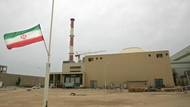 An Iranian flag flies outside the building housing the reactor of the Bushehr nuclear power plant. UN agency says Iran is no longer in violation of its nuclear agreement. (Agencies File Photo) An Iranian flag flies outside the building housing the reactor of the Bushehr nuclear power plant. UN agency says Iran is no longer in violation of its nuclear agreement. (Agencies File Photo)