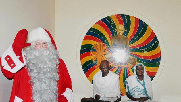 Santa Claus from Finland poses in front of Gandhi Smriti in New Delhi on Monday. (PTI) Santa Claus from Finland poses in front of Gandhi Smriti in New Delhi on Monday. (PTI)
