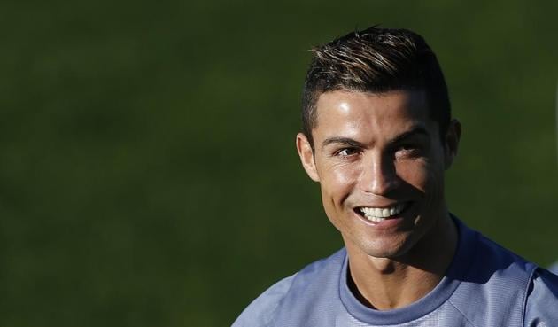 Real Madrid Cristiano Ronaldo smiles during a training session at the Valdebebas camp ahead of Wednesday's Champions League match between Real Madrid and Borussia Dortmund. (AP) Real Madrid Cristiano Ronaldo smiles during a training session at the Valdebebas camp ahead of Wednesday's Champions League match between Real Madrid and Borussia Dortmund. (AP)