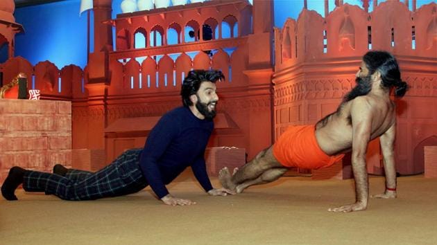 Ranveer Singh performs yoga with Swami Ramdev at an event called Agenda Aaj Tak in New Delhi. (PTI) Ranveer Singh performs yoga with Swami Ramdev at an event called Agenda Aaj Tak in New Delhi. (PTI)