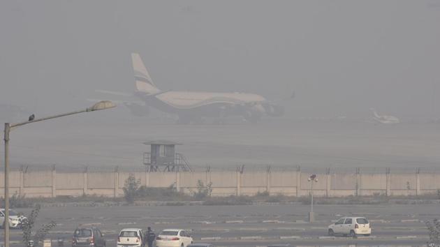 A flight takes off amid dense fog at Indira Gandhi International Airport in New Delhi on Thursday. (Sanjeev Verma/HT Photo)