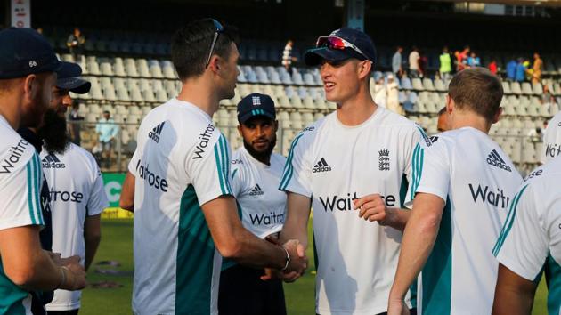 Keaton Jennings is congratulated by teammates after he was given his England cap before the start of day’s play in Mumbai on Thursday. (BCCI) 