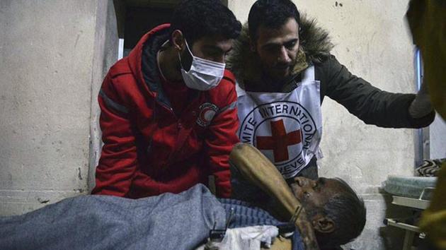 This photo released by the International Committee for the Red Cross on Wednesday, shows members of the Syrian Arab Red Crescent laying a patient on stretcher after taking him out of a medical facility in the Old City of Aleppo in Syria. (AP) This photo released by the International Committee for the Red Cross on Wednesday, shows members of the Syrian Arab Red Crescent laying a patient on stretcher after taking him out of a medical facility in the Old City of Aleppo in Syria. (AP)