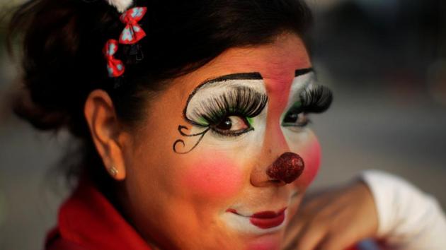 A clown poses for a picture in a parade during Salvadoran Clown Day celebrations in San Salvador, El Salvador on December 7, 2016. (REUTERS)
