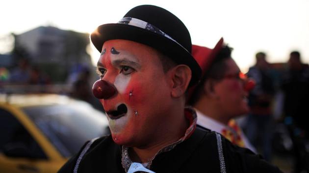 That’s a pretty red nose! A clown during the parade. (REUTERS)