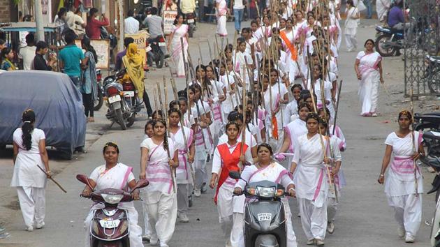 In October last year, members of the samiti organised a ‘path sanchalan’ in Indore, to mark the 90th anniversary of the RSS, its parent wing.(HT File Photo)