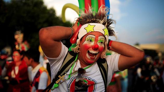 A clown participates in the parade. (REUTERS)