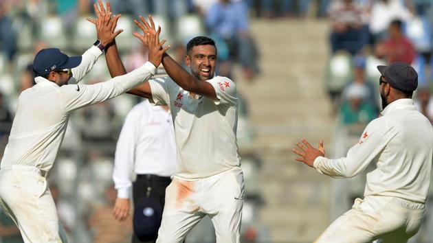 India's Ravichandran Ashwin (centre) celebrates with teammates after scalping an England wicket at the Wankhede stadium in Mumbai on Friday. Ashwin took 6 wicket in England’s first innings, while Ravindra Jadeja took four. (AFP) India's Ravichandran Ashwin (centre) celebrates with teammates after scalping an England wicket at the Wankhede stadium in Mumbai on Friday. Ashwin took 6 wicket in England’s first innings, while Ravindra Jadeja took four. (AFP)