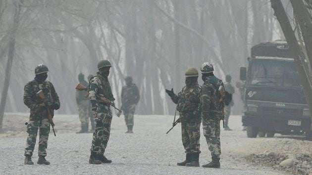 Security forces stand guard during a gunbattle between the army and militants at Arwani in Anantnag district of South Kashmir on Thursday. (PTI photo) Security forces stand guard during a gunbattle between the army and militants at Arwani in Anantnag district of South Kashmir on Thursday. (PTI photo)