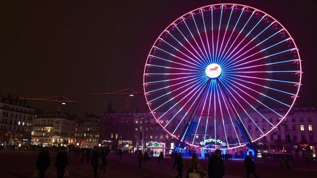 The ferris wheel on Place Bellecour in downtown Lyon illuminated on December 7, 2016. (AFP)