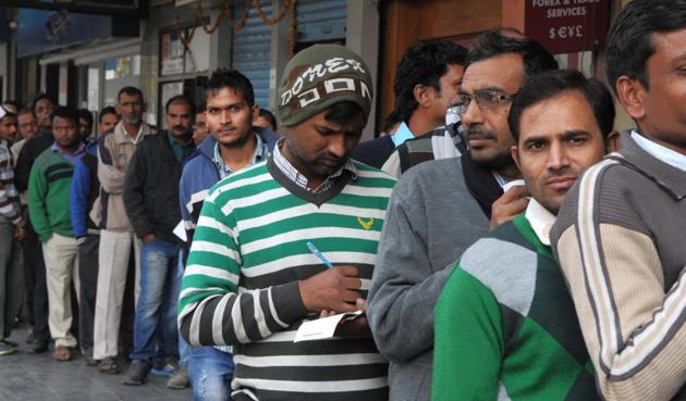 Queues outside banks and ATMs continue to remain long even a month after the demonetisation announcement. Banks are still short of cash and have asked for Rs1,982 crore per day to meet the current requirement in Gurgaon. (Parveen Kumar/HT Photo) Queues outside banks and ATMs continue to remain long even a month after the demonetisation announcement. Banks are still short of cash and have asked for Rs1,982 crore per day to meet the current requirement in Gurgaon. (Parveen Kumar/HT Photo)