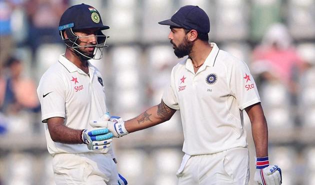 India batsman Murali Vijay and Cheteshwar Pujara in action, the two built a 100 run unbeaten partnership at stumps on the second day of the fourth Test match. (PTI) India batsman Murali Vijay and Cheteshwar Pujara in action, the two built a 100 run unbeaten partnership at stumps on the second day of the fourth Test match. (PTI)