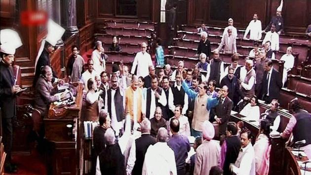 Members protest in the Rajya Sabha during the winter session of Parliament in New Delhi on Friday.(PTI)