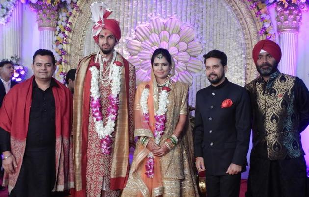 BCCI president Anurag Thakur posed with the couple. (Manoj verma/ht)