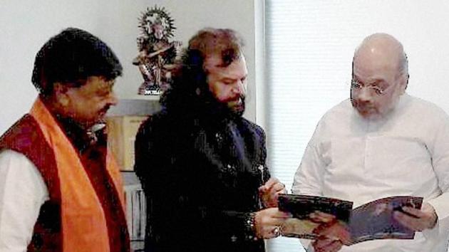 Hans Raj Hans joined the Bharatiya Janata Party in the presence of party President Amit Shah in New Delhi on Saturday. (PTI Photo) Hans Raj Hans joined the Bharatiya Janata Party in the presence of party President Amit Shah in New Delhi on Saturday. (PTI Photo)
