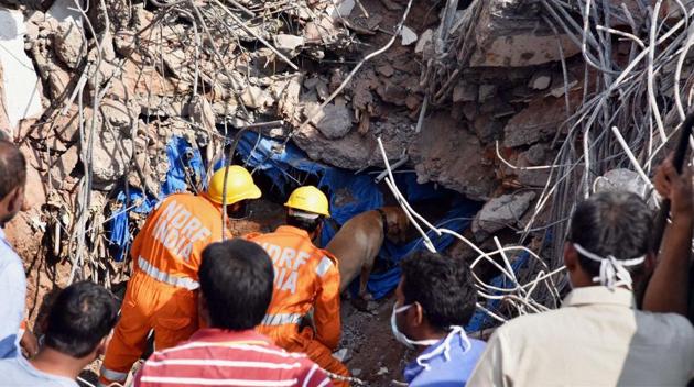 A team of the National Disaster Response Force helps the police with rescue operations after a building collapsed in Nanakramguda, Hyderabad on Thursday night. (PTI) A team of the National Disaster Response Force helps the police with rescue operations after a building collapsed in Nanakramguda, Hyderabad on Thursday night. (PTI)