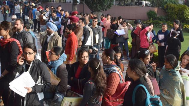 Serpentine queues were witnessed outside Carmel Convent School, Sector 9, Chandigarh on Friday. The school has already received 600 forms for 120 seats in lower kindergarten.(Ravi Kumar/HT Photo)