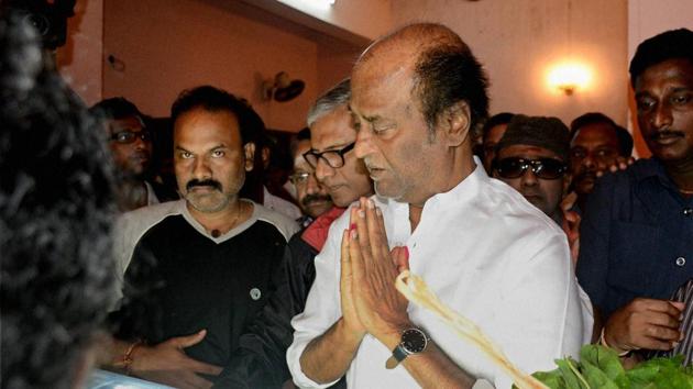 Actor Rajinikanth pays his last respects to political commentator Cho Ramaswamy at his residence in Chennai on Wednesday.(PTI)