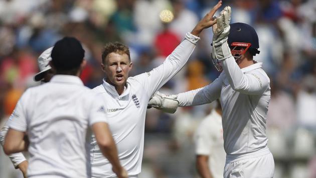 England's Joe Root (centre) took two Indian wickets with his part-time spin bowling -- scalping Parthiv Patel and Ravichandran Ashwin at the Wankhede Stadium. (AP) England's Joe Root (centre) took two Indian wickets with his part-time spin bowling -- scalping Parthiv Patel and Ravichandran Ashwin at the Wankhede Stadium. (AP)