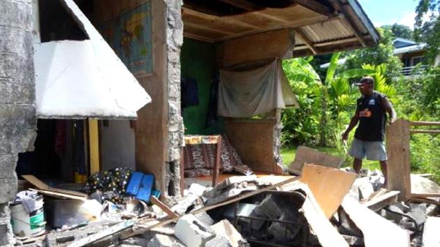 A man stands alongside a building belonging to the World Vision aid organisation that was damaged by an earthquake in Kirakira on the Solomon Islands on Friday. (Reuters) A man stands alongside a building belonging to the World Vision aid organisation that was damaged by an earthquake in Kirakira on the Solomon Islands on Friday. (Reuters)