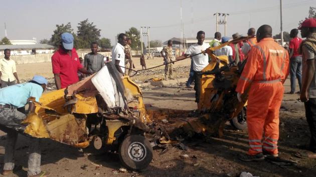 In this Saturday, October 29, 2016 file photo, People clear debris after an explosion in Maiduguri, Nigeria. Nigeria's army says two women suicide bombers blew themselves up Friday morning at a market in northeast Nigeria's Madagali town.(AP Photo) In this Saturday, October 29, 2016 file photo, People clear debris after an explosion in Maiduguri, Nigeria. Nigeria's army says two women suicide bombers blew themselves up Friday morning at a market in northeast Nigeria's Madagali town.(AP Photo)