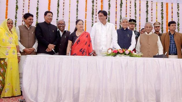 Newly inducted ministers pose for a group photo with governor Kalyan Singh and chief minister Vasundhara Raje after the swearing-in ceremony at Raj Bhavan in Jaipur on Saturday. (PTI) Newly inducted ministers pose for a group photo with governor Kalyan Singh and chief minister Vasundhara Raje after the swearing-in ceremony at Raj Bhavan in Jaipur on Saturday. (PTI)