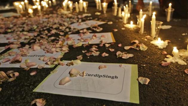 Activists light candles around posters with the names of death row inmates awaiting executions, including that of India national Gurdip Singh, during a vigil against death penalty outside the presidential palace in Jakarta, Indonesia on July 28, 2016. (AP) Activists light candles around posters with the names of death row inmates awaiting executions, including that of India national Gurdip Singh, during a vigil against death penalty outside the presidential palace in Jakarta, Indonesia on July 28, 2016. (AP)