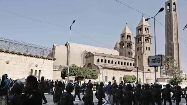 Egyptian security forces walk in front of St. Mark Cathedral in central Cairo, following a bombing. The blast at Egypt's main Coptic Christian cathedral killed dozens of people and wounded many others on Sunday, according to Egyptian state television, making it one of the deadliest attacks carried out against the religious minority in recent memory. (AP Photo) Egyptian security forces walk in front of St. Mark Cathedral in central Cairo, following a bombing. The blast at Egypt's main Coptic Christian cathedral killed dozens of people and wounded many others on Sunday, according to Egyptian state television, making it one of the deadliest attacks carried out against the religious minority in recent memory. (AP Photo)