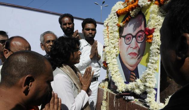 Suspended IAS officer Shashi Karnawat praying to BR Ambedkar at Board Office crossing in Bhopal on Saturday. (Mujeeb Faruqui/HT photo) Suspended IAS officer Shashi Karnawat praying to BR Ambedkar at Board Office crossing in Bhopal on Saturday. (Mujeeb Faruqui/HT photo)
