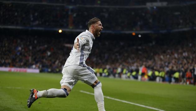 Real Madrid's Sergio Ramos celebrates after scoring the winning goal against Deportivo.(AP)