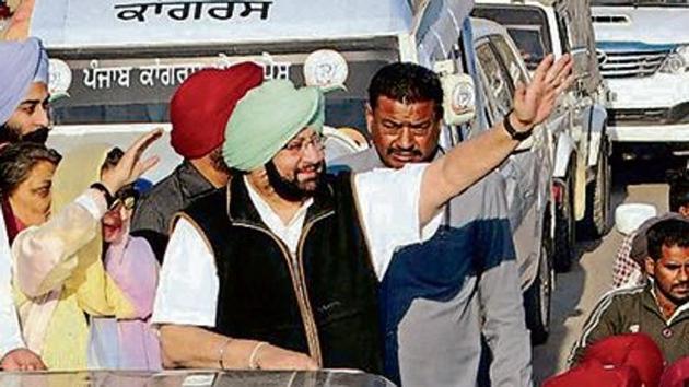 Punjab Congress chief Amarinder Singh and his wife, MLA Preneet Kaur, wave to supporters at a road show in Patiala. (HT file photo) Punjab Congress chief Amarinder Singh and his wife, MLA Preneet Kaur, wave to supporters at a road show in Patiala. (HT file photo)