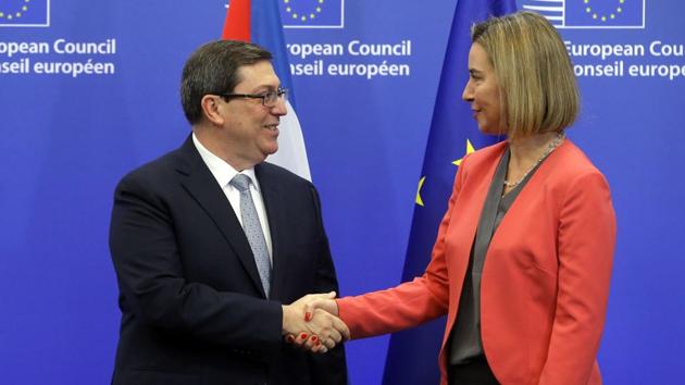 EU high representative for foreign affairs Federica Mogherini (R) welcomes Cuban foreign minister Bruno Rodriguez Parrilla at the start of an EU-Cuba political dialogue and cooperation agreement in Brussels on Monday. (AFP) EU high representative for foreign affairs Federica Mogherini (R) welcomes Cuban foreign minister Bruno Rodriguez Parrilla at the start of an EU-Cuba political dialogue and cooperation agreement in Brussels on Monday. (AFP)