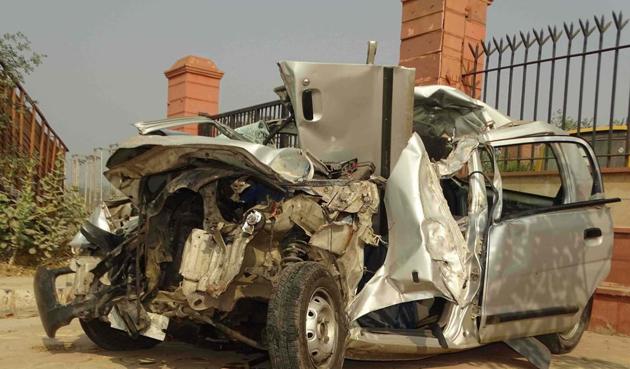 The car that the victims were travelling in was mangled with the impact of the collision.(HT Photo)