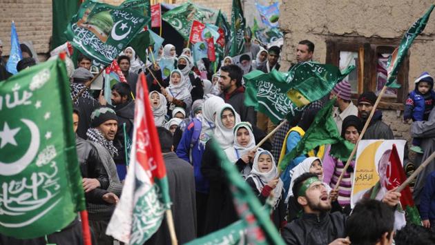 Kashmiri Muslim shout religious slogans to celebrate the Eid-e-Milad in Srinagar. Hundreds of people gathered along the streets to chant religious slogans during the annual Eid-e-Milad festival . (Mukhtar Khan / AP Photo) Kashmiri Muslim shout religious slogans to celebrate the Eid-e-Milad in Srinagar. Hundreds of people gathered along the streets to chant religious slogans during the annual Eid-e-Milad festival . (Mukhtar Khan / AP Photo)