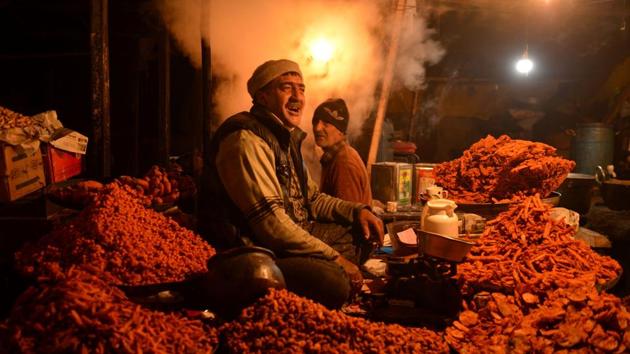 A Kashmiri vendor sells traditional Kashmiri snacks to be sold among devotees at Kashmirs holiest shrine Hazratbal, on the eve of the Muslim festival of Eid-e-Milad-un-Nabi, in Srinagar. (TAUSEEF MUSTAFA / AFP) A Kashmiri vendor sells traditional Kashmiri snacks to be sold among devotees at Kashmirs holiest shrine Hazratbal, on the eve of the Muslim festival of Eid-e-Milad-un-Nabi, in Srinagar. (TAUSEEF MUSTAFA / AFP)