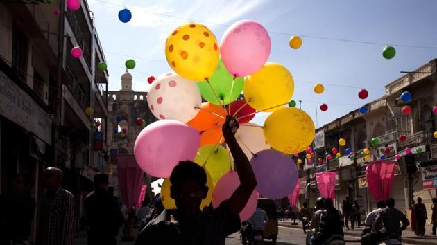 An Indian balloon seller sells balloons during a procession to celebrate Eid-e-Milad, in Hyderabad, India, Monday, Dec. 12, 2016. (Mahesh Kumar A / AP Photo) An Indian balloon seller sells balloons during a procession to celebrate Eid-e-Milad, in Hyderabad, India, Monday, Dec. 12, 2016. (Mahesh Kumar A / AP Photo)