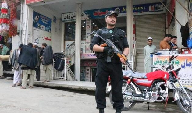 A policeman stands guard at a market in Mingora, in Swat Valley. (Reuters) A policeman stands guard at a market in Mingora, in Swat Valley. (Reuters)
