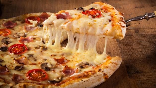 Avoid greasy or high-fat foods like pizza with a lot of cheese (Shutterstock)