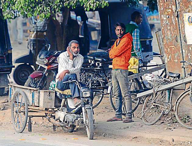 Labourers await jobs at Labour Chowk in Mohali on Tuesday. (Anil Dayal/HT) Labourers await jobs at Labour Chowk in Mohali on Tuesday. (Anil Dayal/HT)