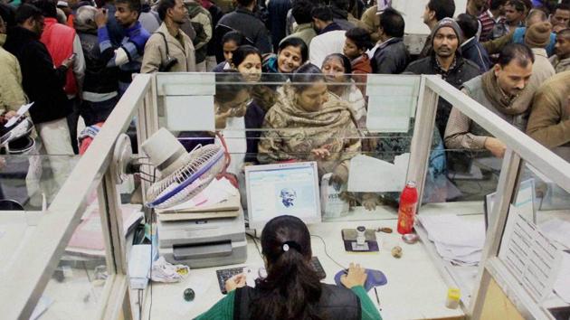 People standing in long queues to deposit or withdraw cash at a bank in Allahabad. (PTI file photo) People standing in long queues to deposit or withdraw cash at a bank in Allahabad. (PTI file photo)