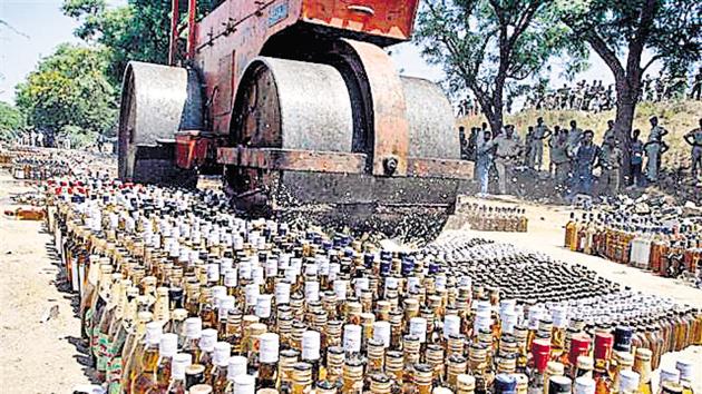 Liquor bottles are crushed under a road roller after the prohibition was announced in Bihar in April.(HT Photo) Liquor bottles are crushed under a road roller after the prohibition was announced in Bihar in April.(HT Photo)